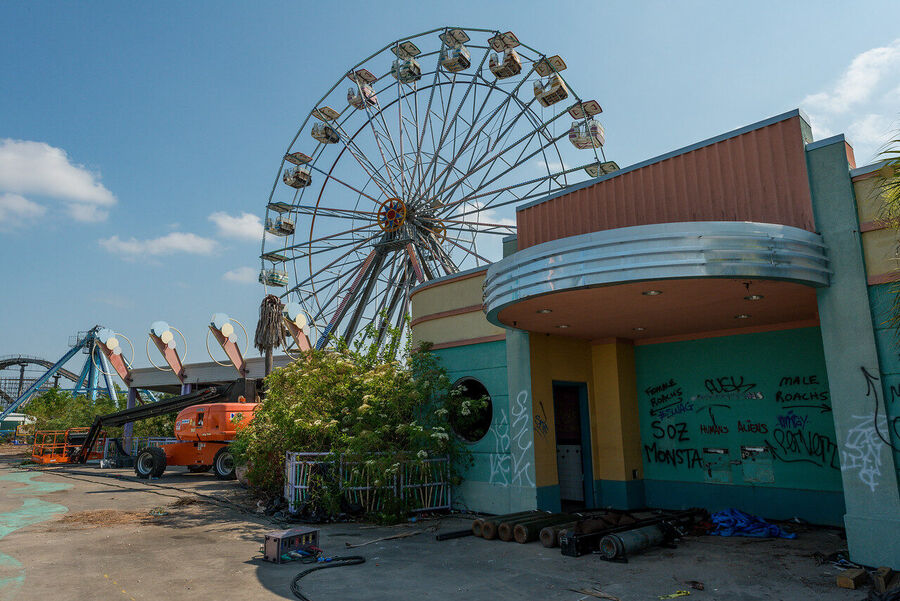 Fine art photograph of an abandoned amusement park building overtaken by tropical vegetation, a meditation on time and entropy