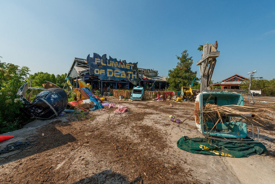 Fine art photograph of an abandoned amusement park building overtaken by tropical vegetation, a meditation on time and entropy