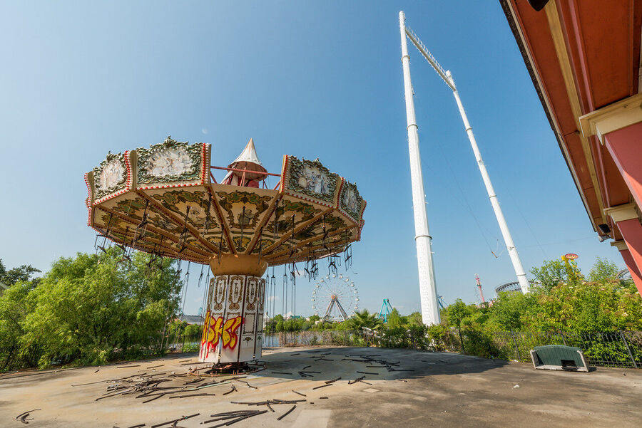 Fine art photograph of an abandoned amusement park building overtaken by tropical vegetation, a meditation on time and entropy