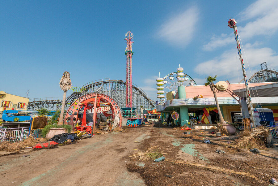 Fine art photograph of an abandoned amusement park building overtaken by tropical vegetation, a meditation on time and entropy
