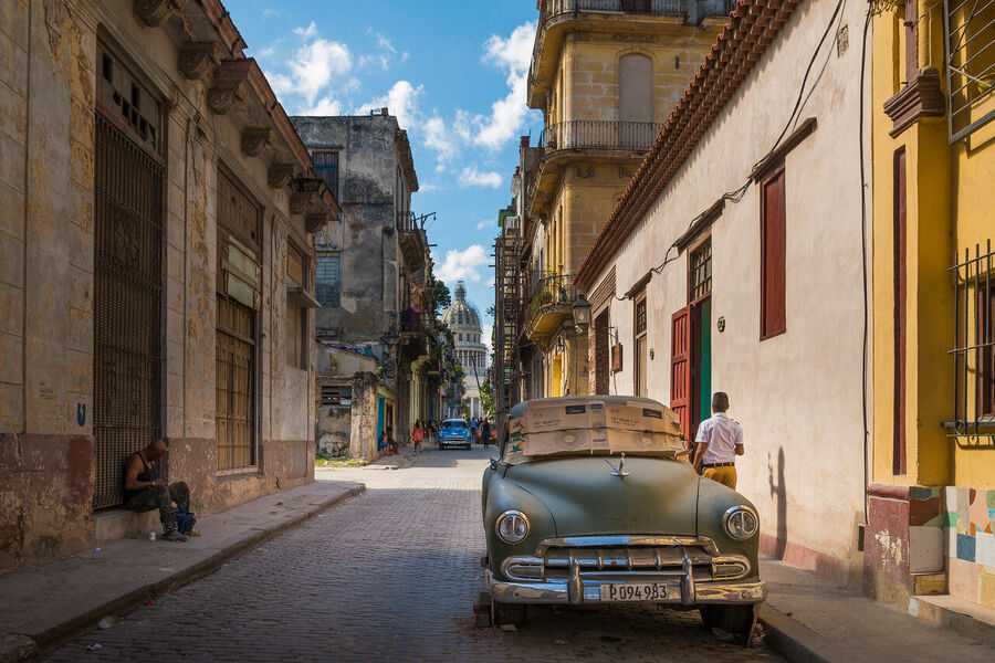 Fine art cityscape print of central Havana at the blue hour, soft streetlight and fading tropical sky creating a palette found nowhere else on earth