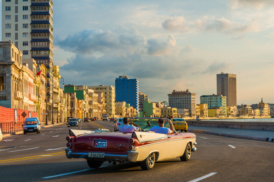 Large format fine art photograph of Old Havana rooftops under a dramatic evening sky, a cityscape unchanged since the 1950s
