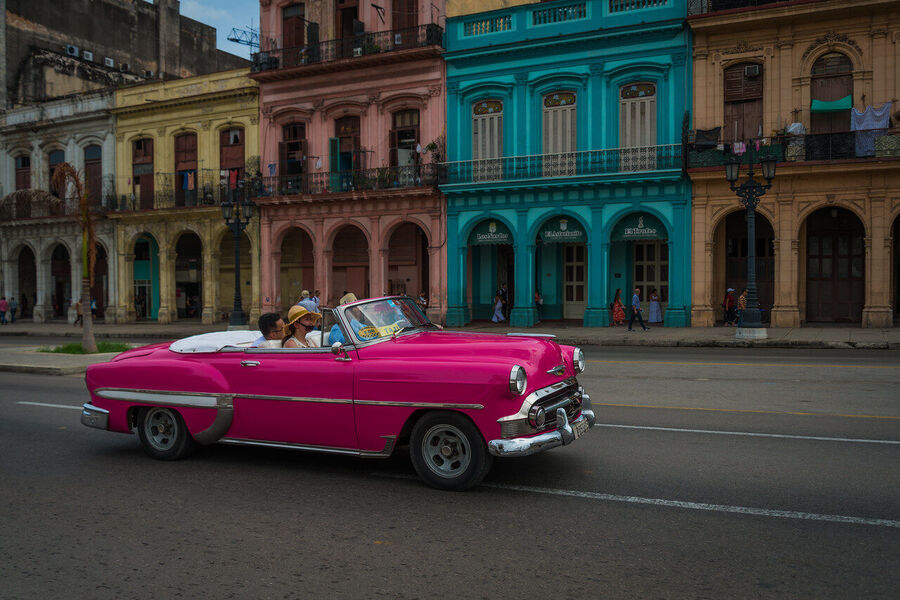 Fine art photography print of the Havana Capitol building at dusk, illuminated façade glowing against a cobalt tropical sky