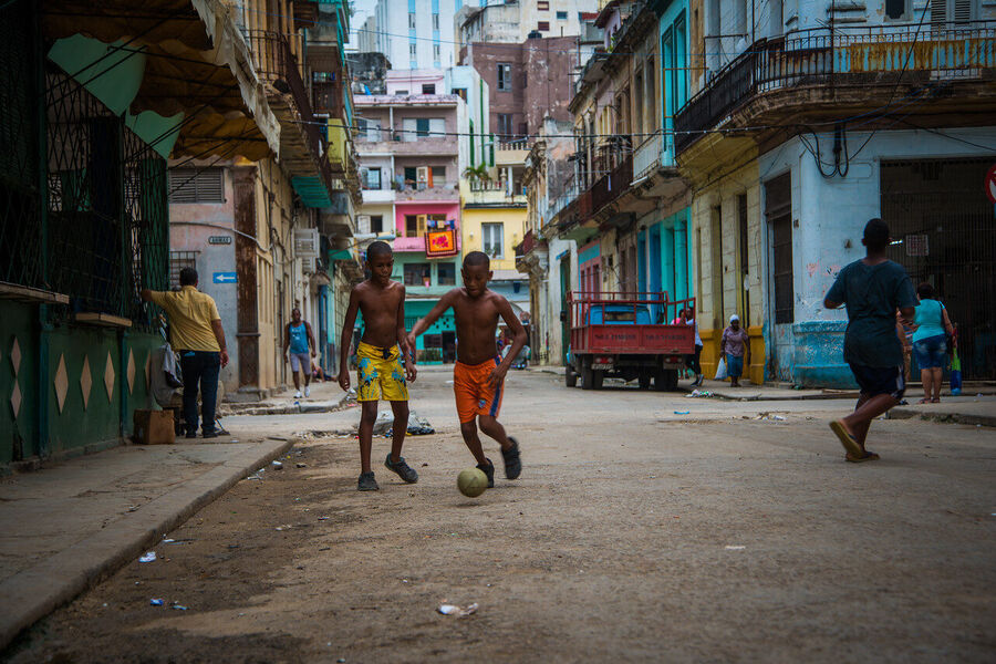 Large format fine art photograph of Old Havana rooftops under a dramatic evening sky, a cityscape unchanged since the 1950s