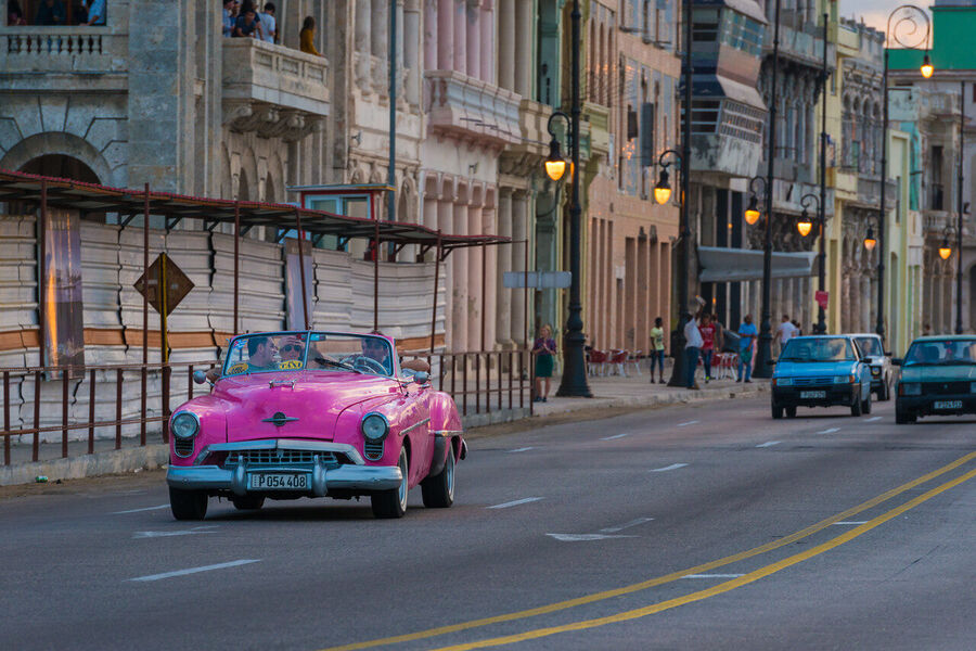 Fine art photography print of the Havana Capitol building at dusk, illuminated façade glowing against a cobalt tropical sky