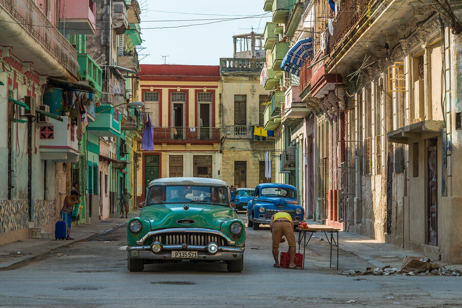 Large format fine art photograph of Old Havana rooftops under a dramatic evening sky, a cityscape unchanged since the 1950s