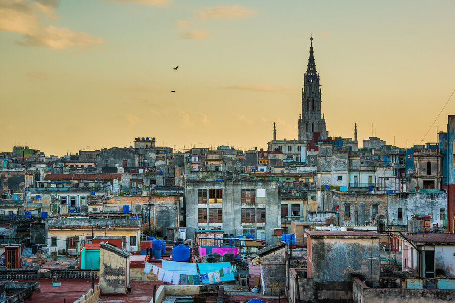 Fine art photography print of the Havana Capitol building at dusk, illuminated façade glowing against a cobalt tropical sky