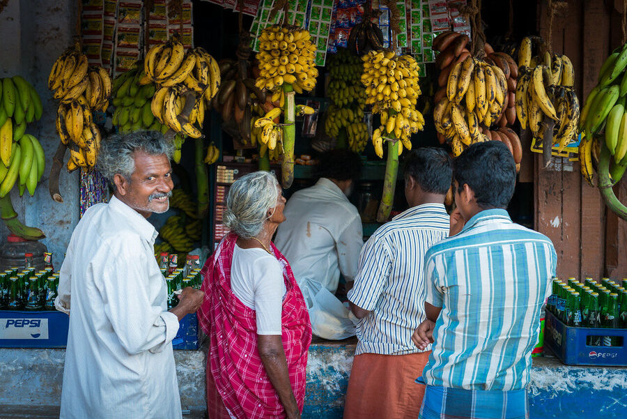 Fine art street photography print from Kerala's backwaters, everyday life along the water channels captured with warmth and compositional precision