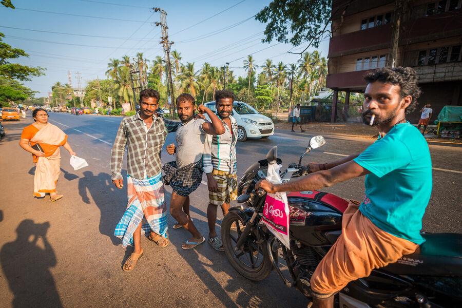 Fine art street photography print from Kerala's backwaters, everyday life along the water channels captured with warmth and compositional precision