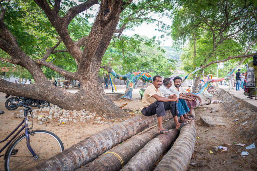 Intimate fine art documentary photograph of children playing in Kerala, authentic joy captured in a fleeting moment of pure childhood