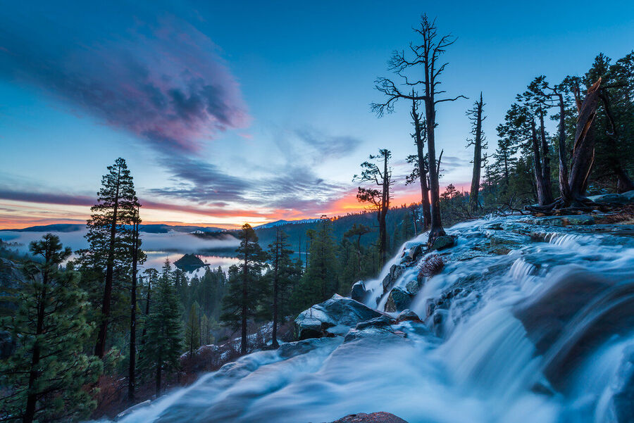 Fine art landscape print of Bonsai Rock at Lake Tahoe's eastern shore, granite formation set against a fire-toned alpenglow sky, Sierra Nevada