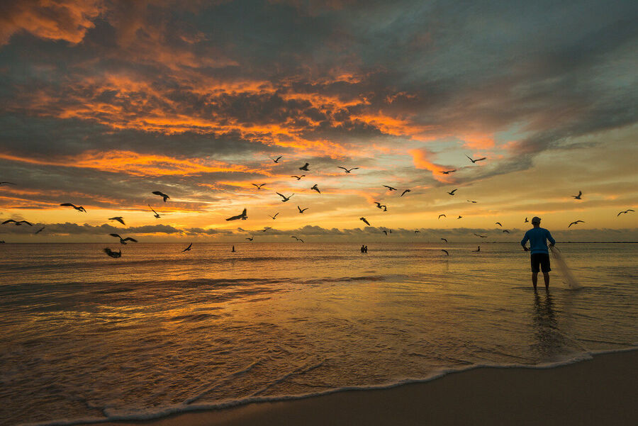 Large format fine art photograph of South Beach at sunrise, tropical storm clouds dispersing as warm light breaks across the Atlantic