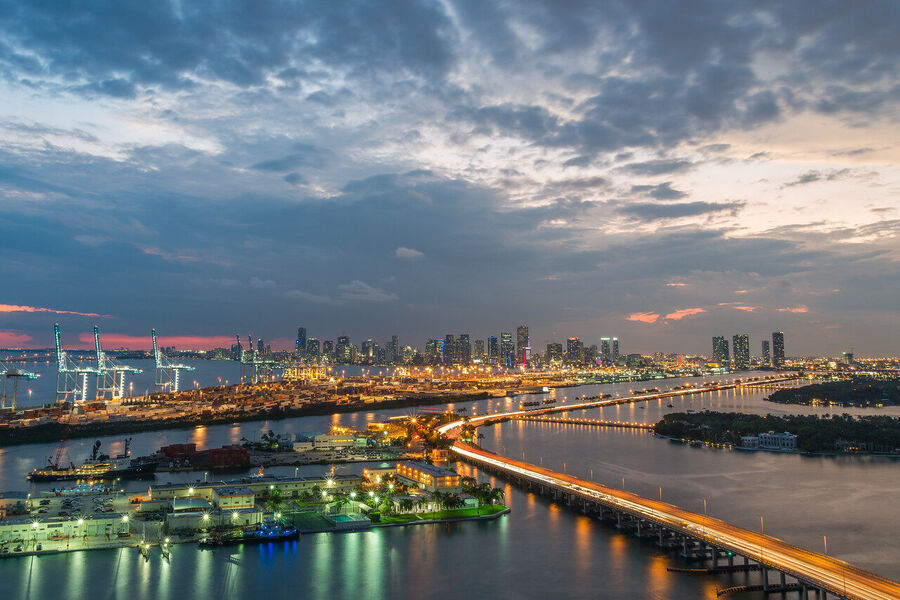 Long exposure fine art print of the Miami skyline reflecting across glassy Biscayne Bay at twilight