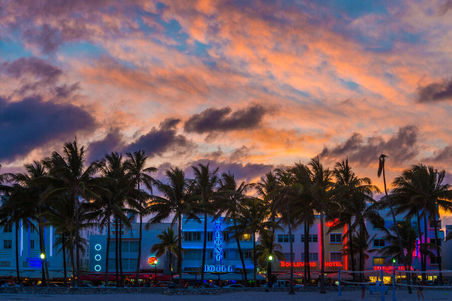 Fine art urban landscape photograph of Miami's downtown financial district towers rising through a coral-toned evening sky