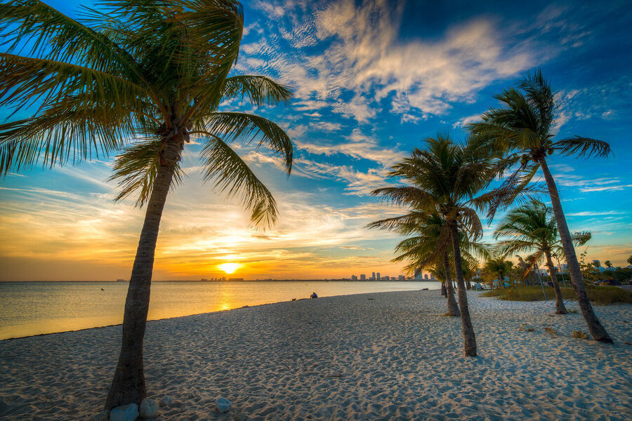 Fine art urban landscape photograph of Miami's downtown financial district towers rising through a coral-toned evening sky