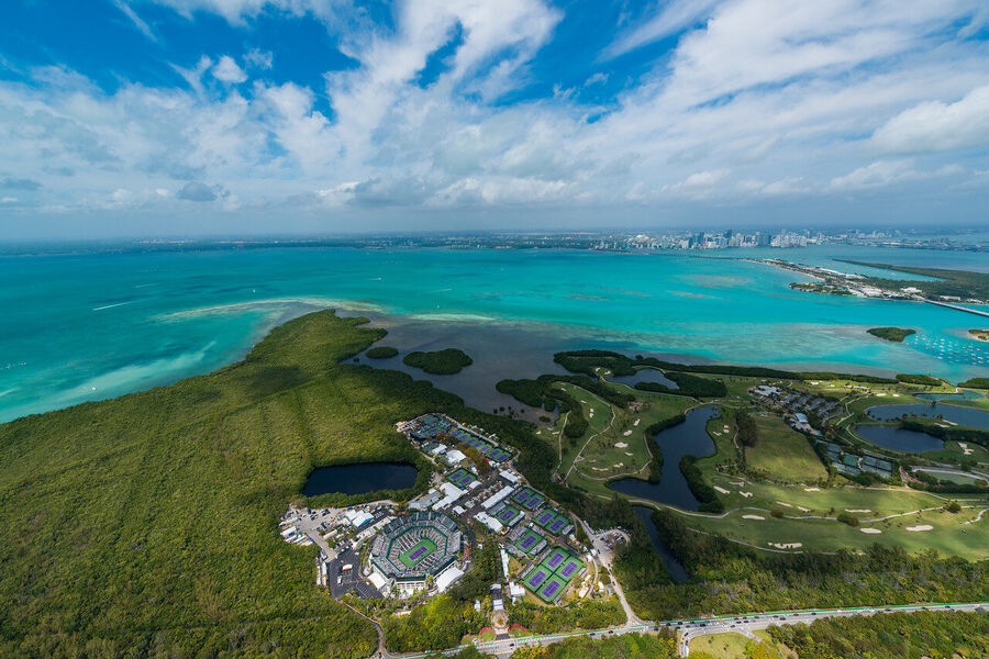 Aerial fine art photography print of Miami Beach coastline and turquoise Atlantic waters under a dramatic sunrise sky