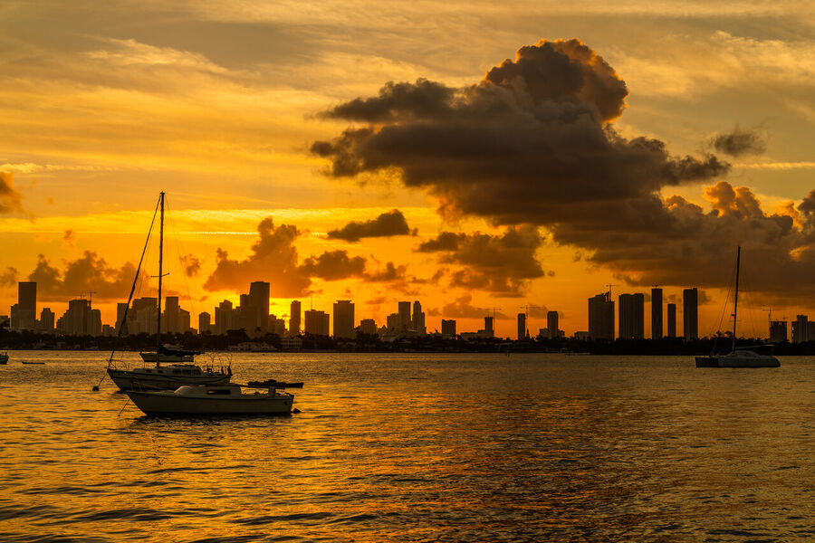 Long exposure fine art print of the Miami skyline reflecting across glassy Biscayne Bay at twilight