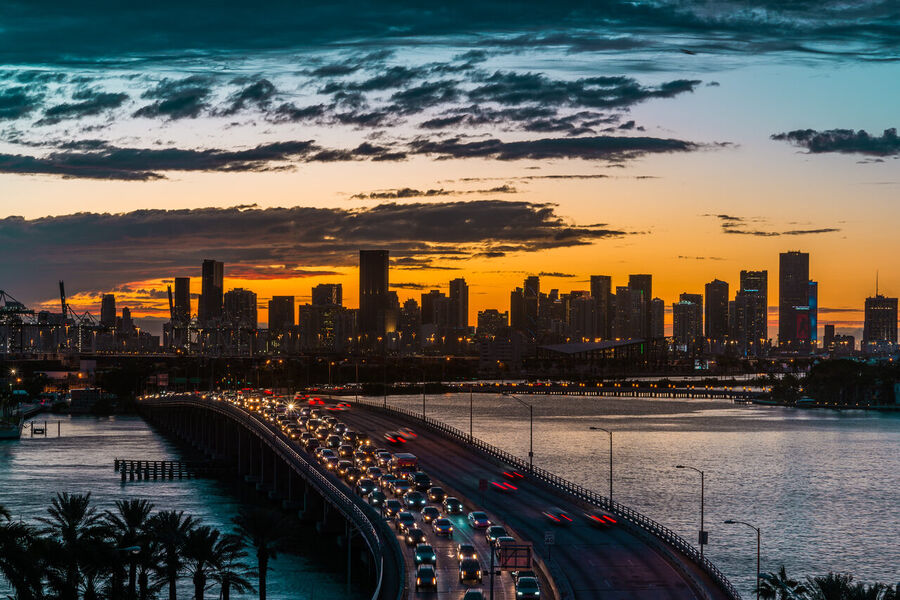 Long exposure fine art print of the Miami skyline reflecting across glassy Biscayne Bay at twilight