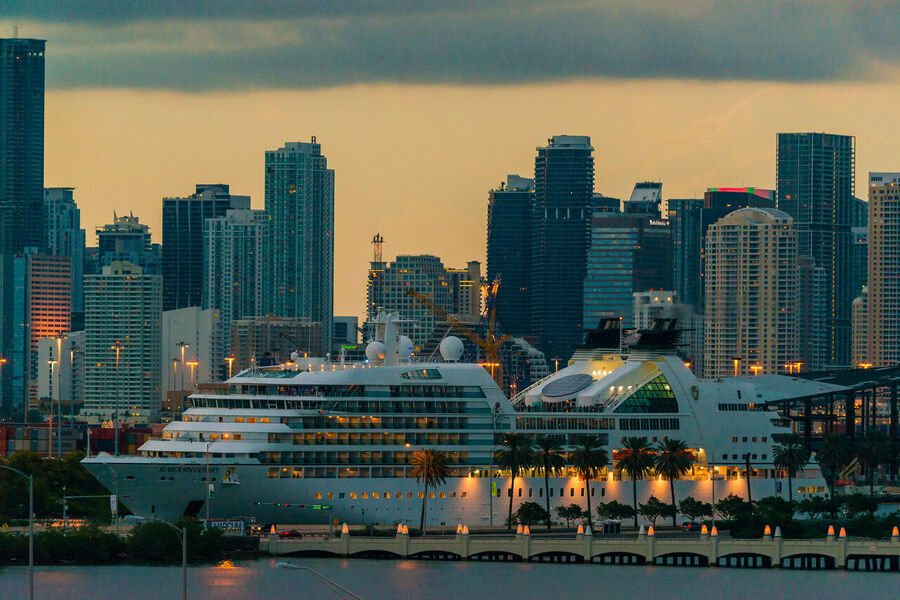 Aerial fine art photography print of Miami Beach coastline and turquoise Atlantic waters under a dramatic sunrise sky