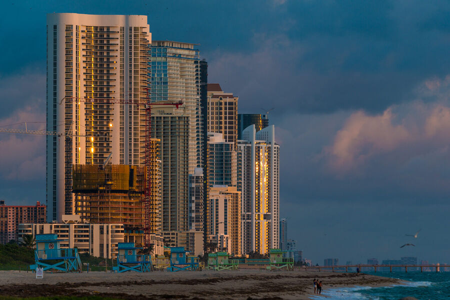 Large format fine art cityscape photograph of Brickell and downtown Miami towers illuminated against a deep blue pre-dawn sky