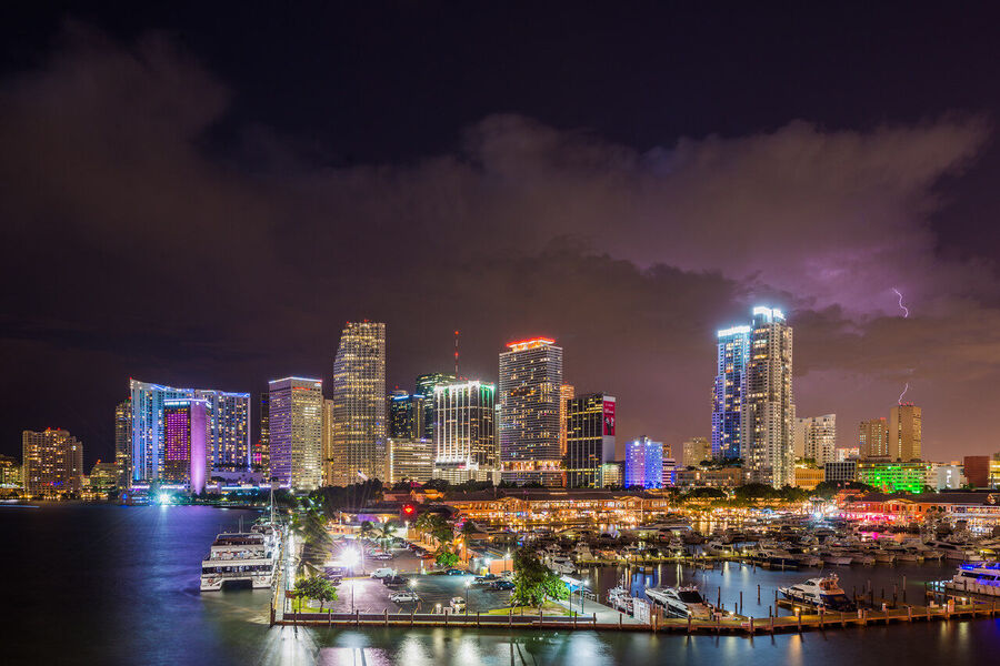 Long exposure fine art print of the Miami skyline reflecting across glassy Biscayne Bay at twilight