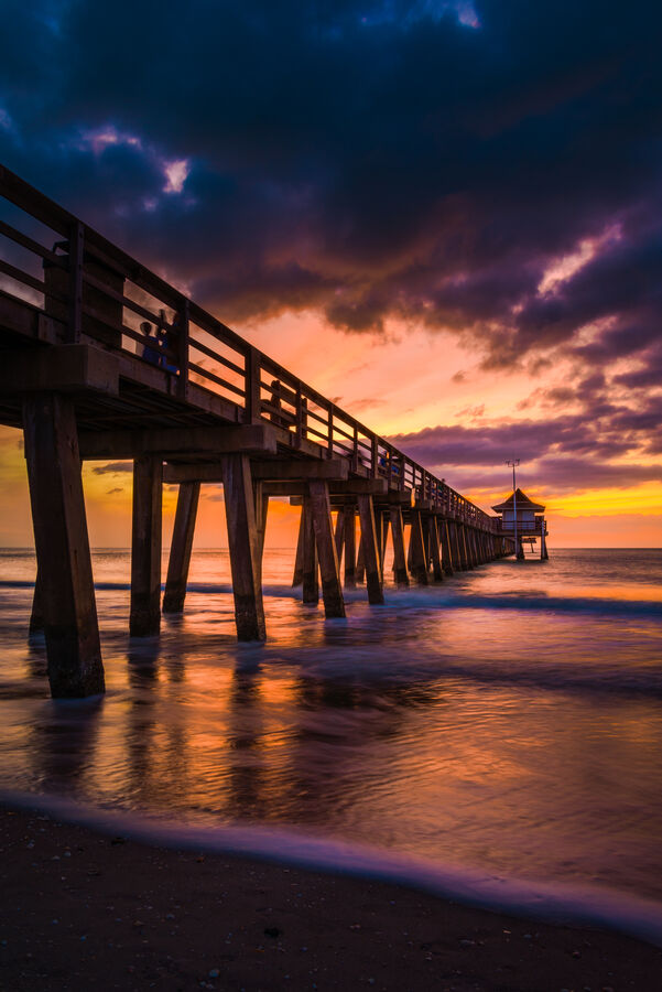 Fine art landscape photograph of Naples, Florida coastline from above at sunset, the barrier island configuration revealed in aerial perspective