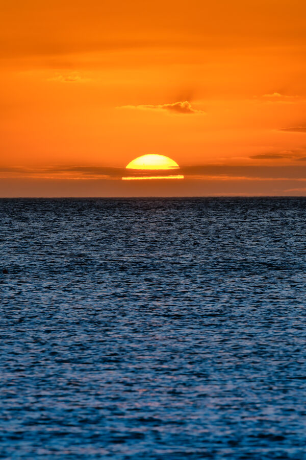 Fine art landscape photograph of Naples, Florida coastline from above at sunset, the barrier island configuration revealed in aerial perspective